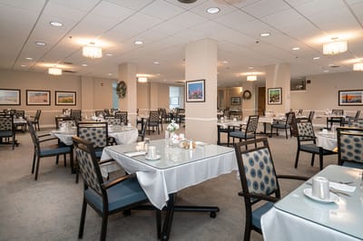 Dining room setup with tables and chairs