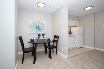 Cozy dining area in a resident's unit with table set