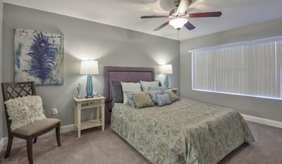 Cozy bedroom setting with floral bedding and decor