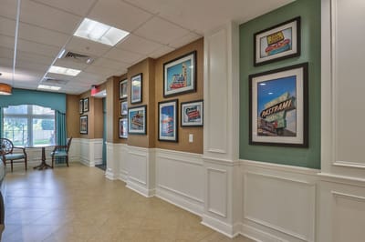 Interior hallway with framed art on the walls