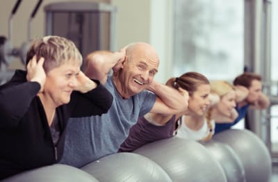 Residents enjoying an activity session with fitness balls