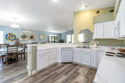 Bright kitchen and dining area in a senior living facility