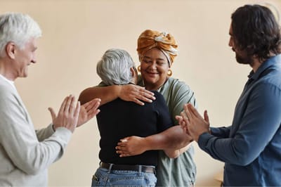 Residents sharing a heartfelt embrace in a warm interior setting