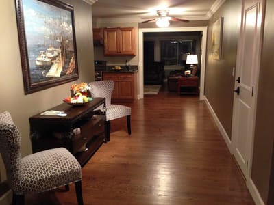 Well-lit corridor with seating and decor