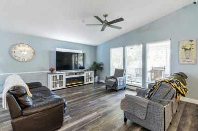 Bright common area with seating and a television