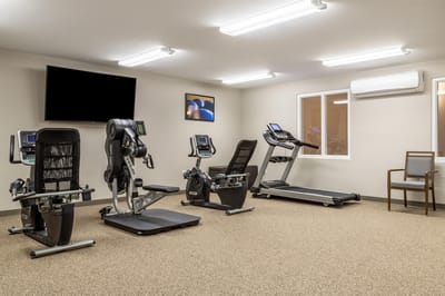 Interior view of a fitness room with exercise equipment