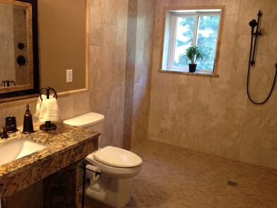 Modern bathroom with granite countertops and natural light