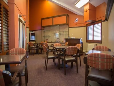 Cozy common area with seating and display cabinets