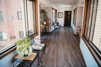 Bright interior hallway with seating and plants