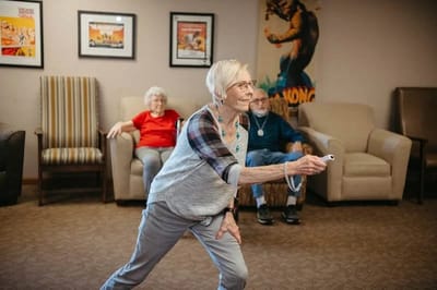 Residents participating in an engaging activity indoors.