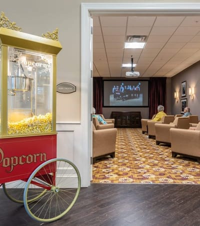 Residents watching a movie in a common area