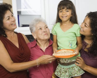 Four generations of family gathered, with food