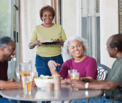 Residents enjoying a meal together at a social gathering