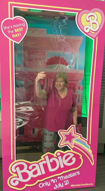 Senior resident enjoying a Barbie-themed decoration