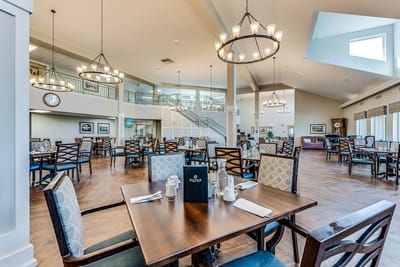 Interior view of a bright dining room with tables and chairs