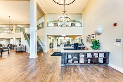 Bright interior of the common area with seating and a reception desk
