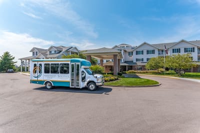 Facility exterior with transport vehicle in foreground