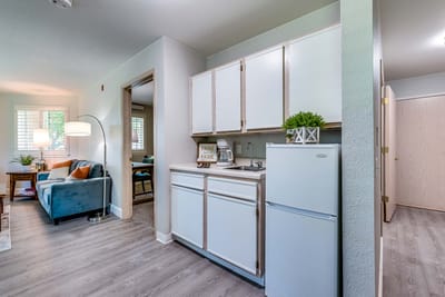 Cozy interior of a resident suite with living area and kitchenette