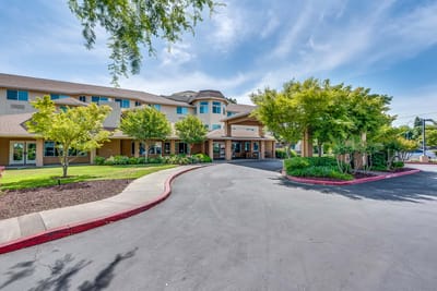 Exterior view of Solstice Senior Living at Lodi with landscaped gardens
