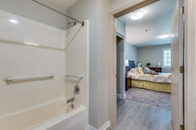 A view of a private resident room and bathroom