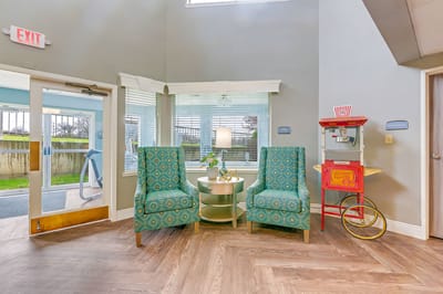 Cozy common area with seating and popcorn cart