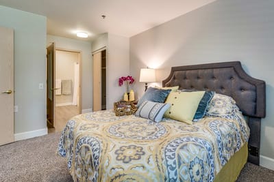 Cozy bedroom with a floral patterned bedspread