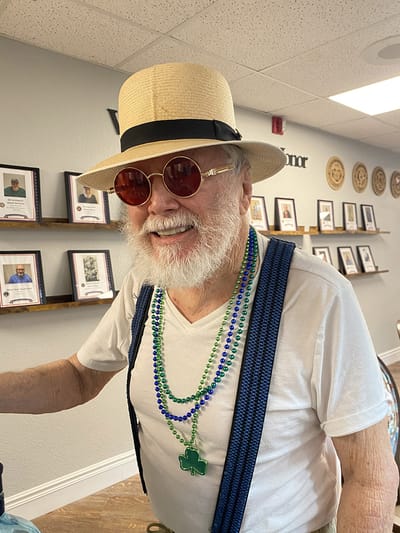 Senior resident celebrating with festive attire and accessories