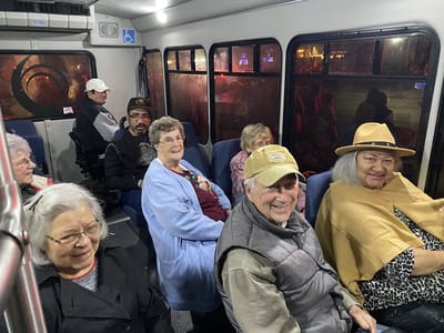 Residents enjoying a bus ride together