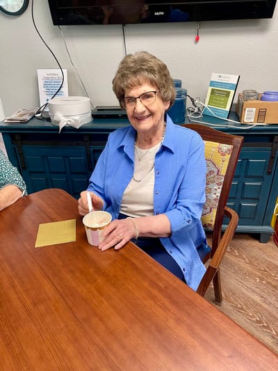 Resident enjoying ice cream in a common area
