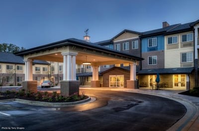 Exterior view of the facility entrance at dusk
