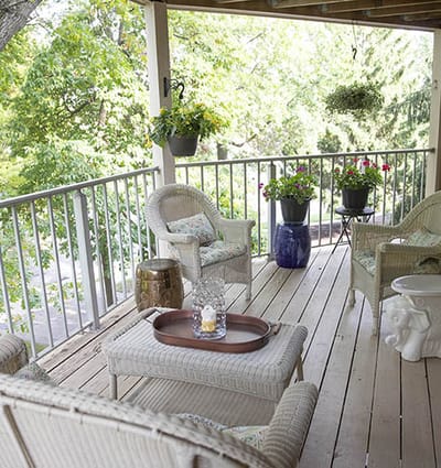 Outdoor seating area with plants and decor