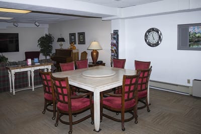 A common area with a large table and seating