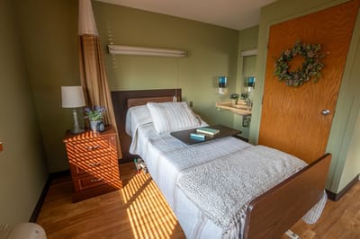 Cozy resident room with bed and decorative elements