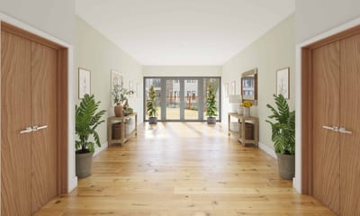 Bright interior hallway with wooden floors and plants