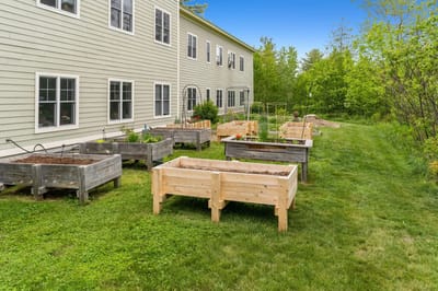 Raised garden beds outside a senior living facility