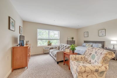 Cozy resident room with a couch and bed