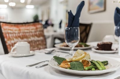 Elegant dining setup with gourmet meal and drinks