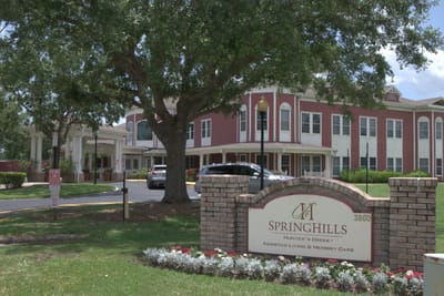 Exterior view of Spring Hills Hunters Creek building and sign