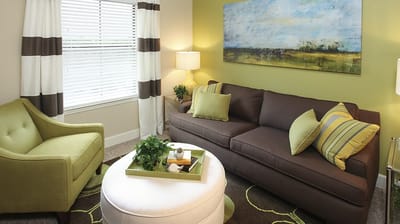 Brightly furnished common area with seating