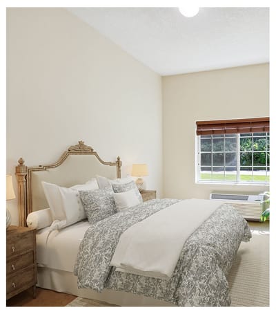 Well-decorated private resident room with a bed and window