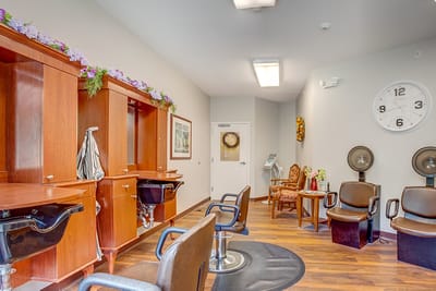 Salon area with styling chairs and mirrors