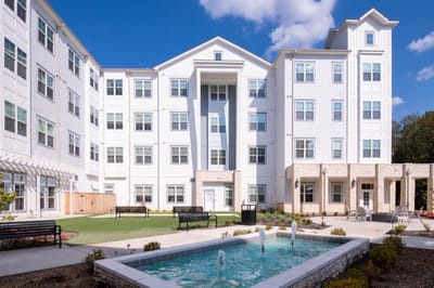 Exterior view of the facility with water fountain