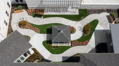 Aerial view of landscaped outdoor pathways and gazebo