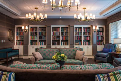 Cozy common area with bookshelves and couches