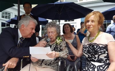 Residents celebrating an event outdoors with family