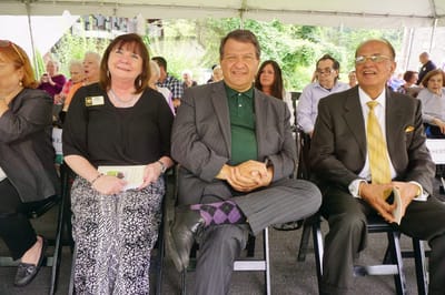 Guests attending an outdoor event at a senior living facility