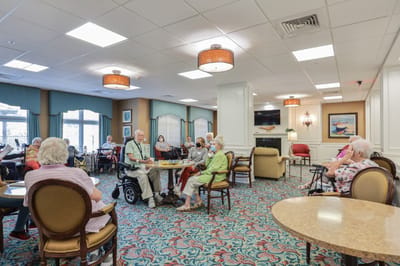 Residents enjoying a social activity in a community common area.