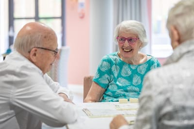 Seniors enjoying a conversation at a table