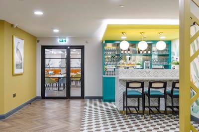 Interior view of a vibrant dining area with a bar.