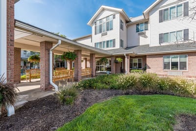 Outdoor seating area with green landscaping